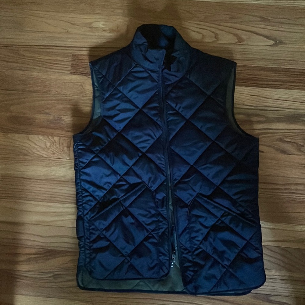 Men’s authentic J. Crew quilted vest. Black w/ khaki interior size extra small.